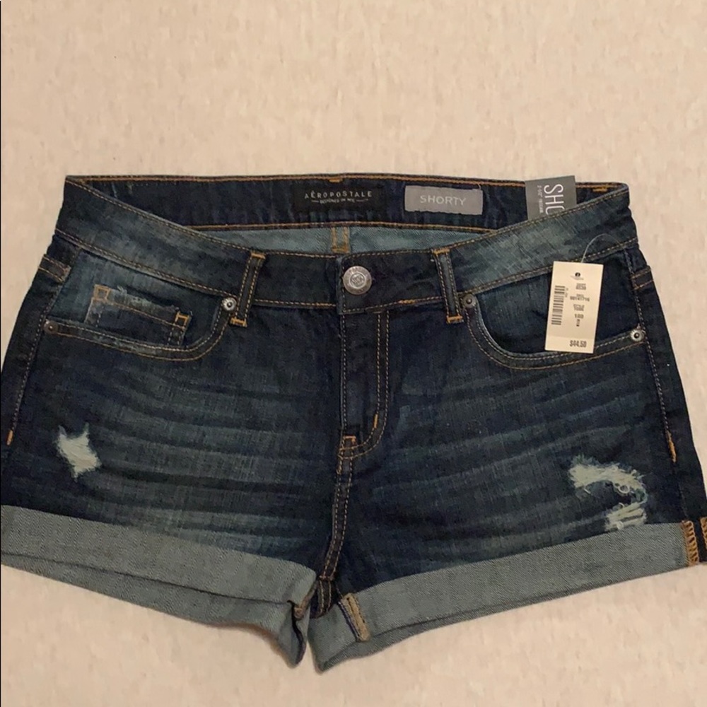 Distressed shorts with a 2 1/2 inseam.